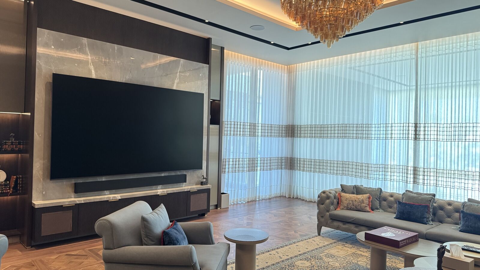 Media wall and seating with automated lighting at the Kataria Residence