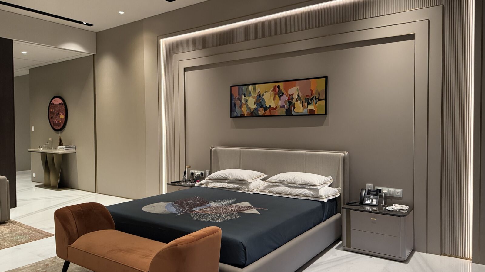 Primary bedroom suite with scene-controlled lighting at the Kataria Residence